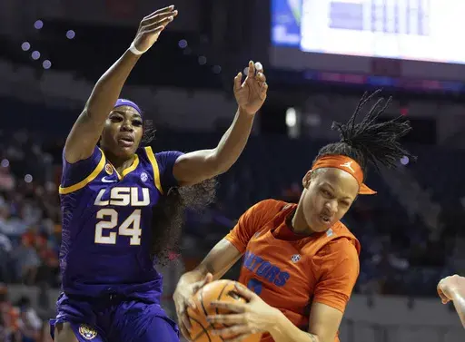 Florida guard Me'Arah O'Neal, right, rebounds past LSU guard Aneesah Morrow (24) during the first half an NCAA college basketball game Sunday, Jan. 19, 2025, in Gainesville, Fla. (AP Photo/Alan Youngblood)