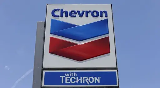 This Tuesday, May 2, 2017, photo shows a Chevron sign at a gas station in Miami. (AP Photo/Alan Diaz, File)