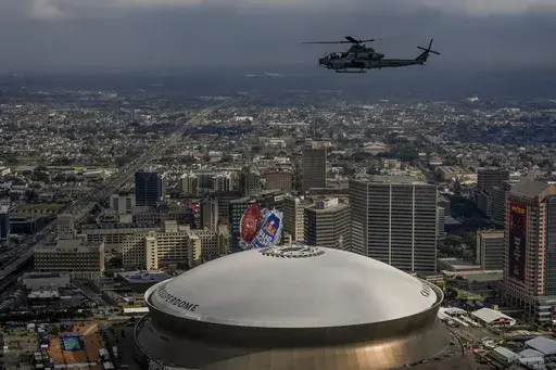 A UH-1Y Venom helicopter from Marine Light Attack Squadron 773 flies over Caesars Superdome ahead of Super Bowl 59 between the Philadelphia Eagles and the Kansas City Chiefs, Saturday, Feb. 8, 2025, in New Orleans. (AP Photo/Julia Demaree Nikhinson)