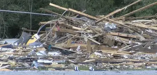 This image made from video provided by KPLC-TV shows debris from a house in Ragley, La., that was destroyed by an explosion, killing a teenage boy from Alabama and injuring other people on Saturday, Aug. 31, 2024. (KPLC-TV via AP)