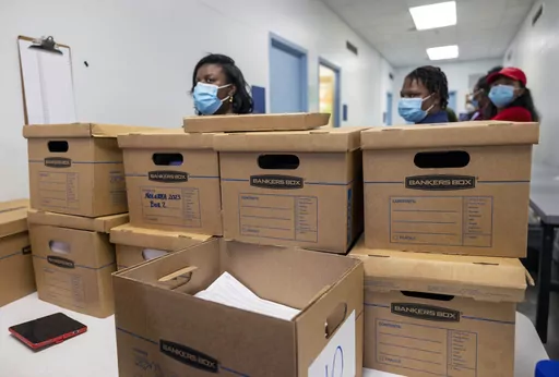 Boxes filled with recall petitions for New Orleans Mayor LaToya Cantrell are delivered to City Hall by nolatoya.org organizers and volunteers on Feb. 22, 2023, in New Orleans. A judge who approved a court settlement lowering the number of signatures needed on a recall petition against New Orleans Mayor LaToya Cantrell didn't disclose that she had signed the petition. (Chris Granger/The Times-Picayune/The New Orleans Advocate via AP, File)