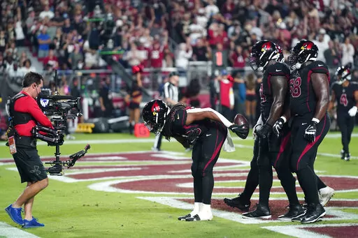 Arizona Cardinals running back Keaontay Ingram (30) celebrate his touchdown during the first half of an NFL football game against the New Orleans Saints, Thursday, Oct. 20, 2022, in Glendale, Ariz. (AP Photo/Ross D. Franklin)