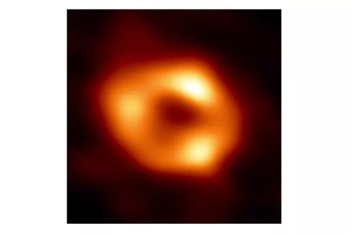 This image released by the Event Horizon Telescope Collaboration, Thursday, May 12, 2022, shows a black hole at the center of our Milky Way galaxy. The Milky Way black hole is called Sagittarius A*, near the border of Sagittarius and Scorpius constellations. It is 4 million times more massive than our sun. The image was made by eight synchronized radio telescopes around the world. (Event Horizon Telescope Collaboration via AP)