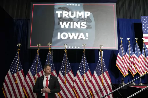 A U.S, Secret Service agent stands his post before Republican presidential candidate former President Donald Trump speaks at a caucus night party in Des Moines, Iowa, Monday, Jan. 15, 2024. (AP Photo/Andrew Harnik)