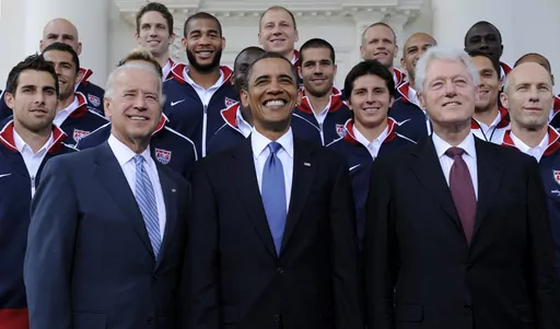 President Barack Obama, flanked by Vice President Joe Biden, left, and former President Bill Clinton, right, pose for a photo with the U.S. World Cup soccer team under the North Portico of the White House in Washington, May 27, 2010. President Joe Biden will share a stage with Barack Obama and Bill Clinton on Thursday in New York as he raises money for his reelection campaign. It's a one-of-a-kind political extravaganza that will showcase decades of Democratic leadership. (AP Photo/Susan Walsh, 