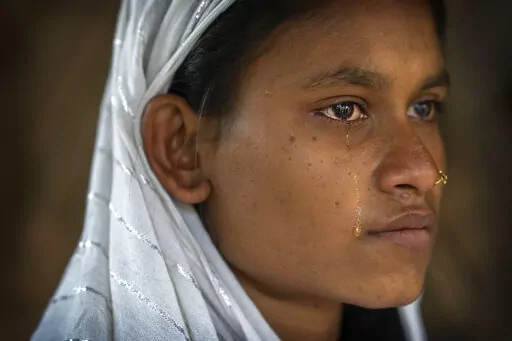 Nureja Khatun, 19, cries as she waits in her shanty home for her husband Akbor Ali to return, in Morigaon district of Indian northeastern state of Assam, Saturday, Feb. 11, 2023. Khatun's husband is one among more than 3,000 men, including Hindu and Muslim priests, who were arrested nearly two weeks ago in the northeastern state of Assam under a wide crackdown on illegal child marriages involving girls under the age of 18. (AP Photo/Anupam Nath)