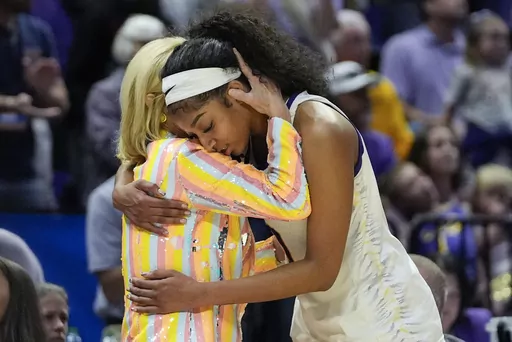 LSU head coach Kim Mulkey hugs forward Angel Reese late in the second half of a second-round college basketball game against Middle Tennessee in the women's NCAA Tournament in Baton Rouge, La., Sunday, March 24, 2024. LSU won 83-56. (AP Photo/Gerald Herbert)