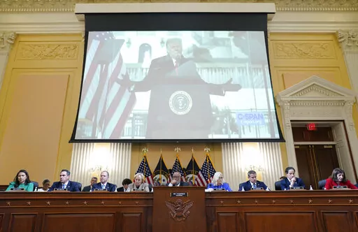 A video of former President Donald Trump speaking during a rally near the White House on Jan. 6, 2021, is shown as committee members from left to right, Rep. Stephanie Murphy, D-Fla., Rep. Pete Aguilar, D-Calif., Rep. Adam Schiff, D-Calif., Rep. Zoe Lofgren, D-Calif., Chairman Bennie Thompson, D-Miss., Vice Chair Liz Cheney, R-Wyo., Rep. Adam Kinzinger, R-Ill., Rep. Jamie Raskin, D-Md., and Rep. Elaine Luria, D-Va., look on, during a public hearing of the House select committee investigating the