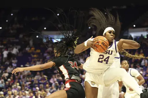 LSU guard Aneesah Morrow (24) pulls down a rebound against Louisiana-Lafayette forward Kamryn Jones (34) in the first half an NCAA college basketball game in Baton Rouge, La., Sunday, Dec. 15, 2024. (AP Photo/Peter Forest)