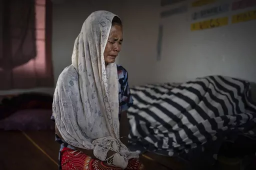 Kim Neineng, 43, a tribal Kuki, cries as she narrates the killing of her husband, at a relief camp in Churachandpur, in the northeastern Indian state of Manipur, Tuesday, June 20, 2023. Neineng escaped with her four children to a nearby relief camp when a Meitei mob descended on their village. Her husband was killed by the mob — beaten with iron bars, his legs chopped off and then picked and tossed in the raging fire that had already engulfed his home. The deadly conflict between the two ethni