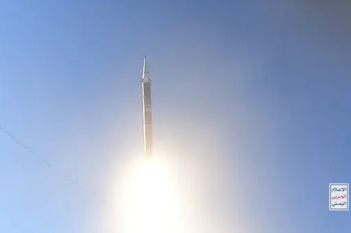 This frame grab from video released by the Ansar Allah Media Office of Yemen's Houthi rebels on Wednesday, June 5, 2024, shows the launch of a Palestine missile from a rebel-controlled area of Yemen. Yemen's Houthi rebels have unveiled a new, solid-fuel missile in their arsenal that resembles aspects of one earlier displayed by Iran that Tehran described as flying at hypersonic speeds. The logo in the bottom right reads in Arabic: "Yemen War Media." (Ansar Allah Media Office via AP)