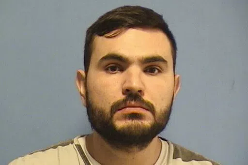 This booking photo provided by the St. Tammany Parish, La.,  Sheriff’s Office shows Ahmad Slyyeh, 30, of Metairie, La., who turned himself in Wednesday night, Feb. 3, 2022, while detectives were searching for him, and was booked on one count of solicitation for murder, the St. Tammany Parish Sheriff’s office said in a news release (St. Tammany Parish Sheriff’s Office via AP)