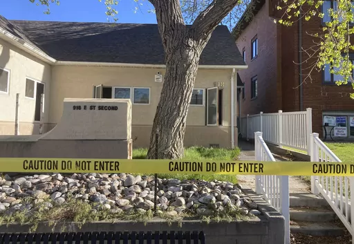The fire-damaged Wellspring Health Access clinic is cordoned by tape on May 25, 2022, in in Casper, Wyo. Wyoming’s first full-service abortion clinic in years defiantly opened Thursday, April, 20, 2023, nearly one year after an arson attack ravaged it and despite looming laws that could shut it down with some of the toughest abortion restrictions in the U.S. (AP Photo/Mead Gruver, File)