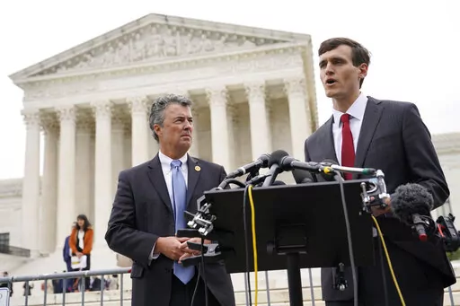 Alabama Solicitor General Edmund LaCour, right, speaks alongside Alabama Attorney General Steve Marshall following oral arguments in Merrill v. Milligan, an Alabama redistricting case that could have far-reaching effects on minority voting power across the United States, outside the Supreme Court on Capitol Hill in Washington, Tuesday, Oct. 4, 2022. (AP Photo/Patrick Semansky)