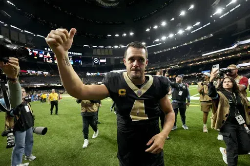 New Orleans Saints quarterback Derek Carr (4) leaves the field after the team's win against the Carolina Panthers following an NFL football game Sunday, Sept. 8, 2024, in New Orleans. (AP Photo/Gerald Herbert)