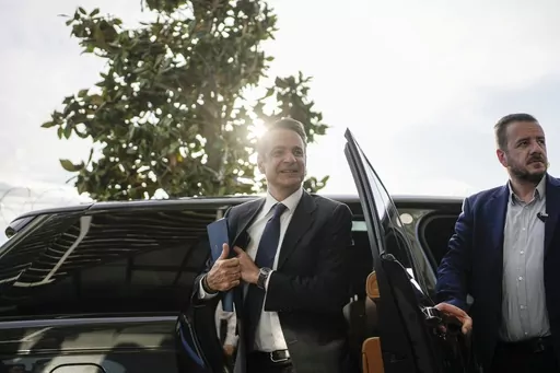 Greece's Prime Minister and New Democracy leader Kyriakos Mitsotakis arrives for an interview at Alpha television station during his election campaign in Athens, Greece, Tuesday, April 25, 2023. (AP Photo/Thanassis Stavrakis)