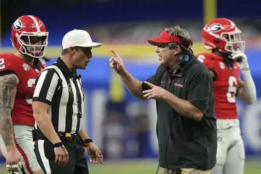 Georgia head coach Kirby Smart, right, questions a call during the second half against Notre Dame in the quarterfinals of a College Football Playoff, Thursday, Jan. 2, 2025, in New Orleans. (AP Photo/Gerald Herbert)