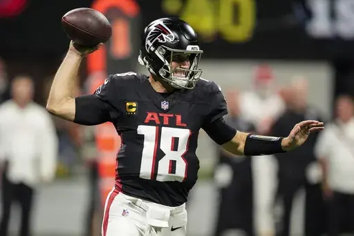 Atlanta Falcons quarterback Kirk Cousins (18) works in the pocket against the Kansas City Chiefs during the first half of an NFL football game, Sunday, Sept. 22, 2024, in Atlanta. (AP Photo/Brynn Anderson)