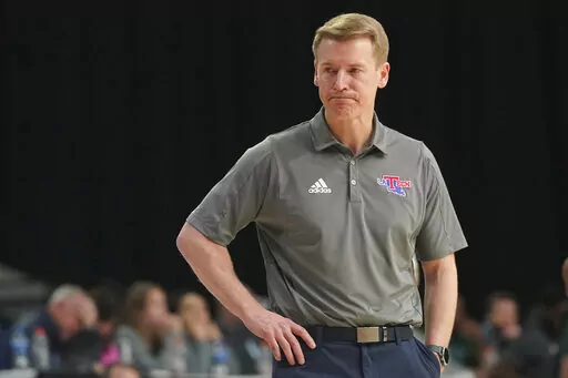 Louisiana Tech coach Eric Konkol watches during the second half of the team's NCAA college basketball game against UAB for the championship of the Conference USA men's tournament in Frisco, Texas, Saturday, March 12, 2022. UAB won 82-73. (AP Photo/LM Otero)