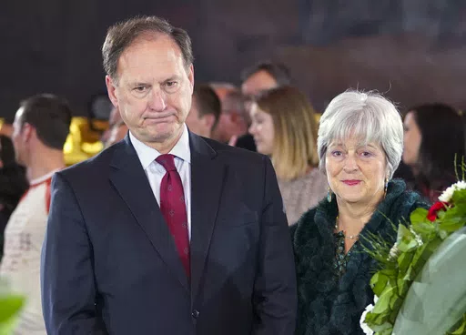 Supreme Court Justice Samuel Alito Jr., left, and his wife Martha-Ann Alito, pay their respects at the casket of Reverend Billy Graham at the Rotunda of the U.S. Capitol Building in Washington, Feb. 28, 2018. Alito rejects calls to step aside from Supreme Court cases on Trump and Jan. 6. (AP Photo/Pablo Martinez Monsivais, File)