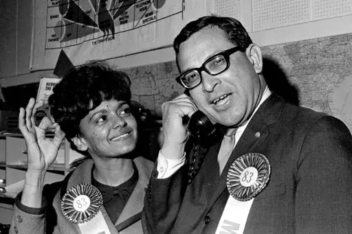 Attorney Ernest Morial, right, speaks on the telephone as his wife, Sybil, looks on after he won an outright victory in his race for a House seat in the Louisiana Legislature, in New Orleans, Nov. 5, 1967. (AP Photo/Jack Thornell)