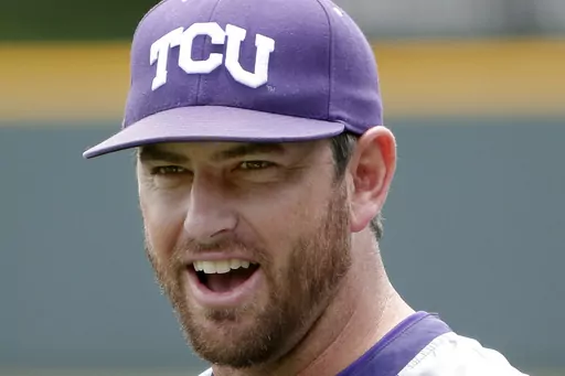 Then-TCU assistant coach Kirk Saarloos watching as players warm up at practice in Fort Worth, Texas, May 28, 2014. TCU has gotten out to a program-best 12-0 start with big contributions from freshmen and transfers who have replaced major contributors from the team that made the College World Series. “They find ways to win,” coach Kirk Saarloos said. (Brandon Wade /Star-Telegram via AP, File, File)