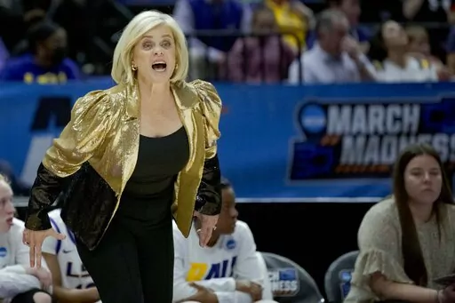LSU head coach Kim Mulkey calls to her team in the first half of a women's college basketball game against Jackson State in the first round of an NCAA tournament, Saturday, March 19, 2022, in Baton Rouge, La. (AP Photo/Matthew Hinton)