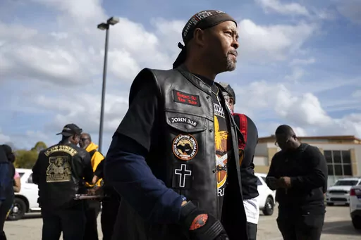 Rev. Alyn Waller of Enon Tabernacle Baptist Church looks on after rallying fellow bikers for a "Black Bikers Vote" procession, Saturday, Nov. 5, 2022, in Philadelphia. (AP Photo/Joe Lamberti)