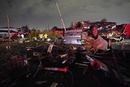 A car is flipped over after a tornado tore through the area in Arabi, La., Tuesday, March 22, 2022, in a part of the city that had been heavily damaged by Hurricane Katrina 17 years earlier. A United Nations report released on Monday, April 25, 2022, says disasters are on the rise are just going to get worse. A new UN report says the number of disasters, from climate change to COVID-19, are going to jump to about 560 a year by 2030. (AP Photo/Gerald Herbert, File)