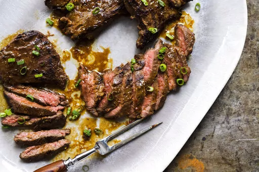 This image released by Milk Street shows a recipe for Miso-Marinated Skirt Steak. (Milk Street via AP)