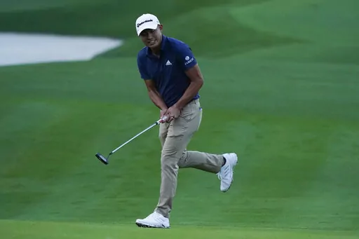 Collin Morikawa reacts to his putt on the second hole during the first round of play in The Players Championship golf tournament Thursday, March 10, 2022, in Ponte Vedra Beach, Fla. (AP Photo/Lynne Sladky)