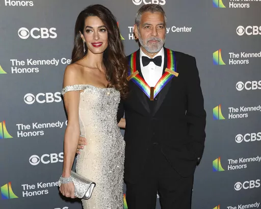 2022 Kennedy Center Honoree George Clooney and his wife, Amal Clooney, arrive at the Kennedy Center Honors on Sunday, Dec. 4, 2022, at The Kennedy Center in Washington. (Photo by Greg Allen/Invision/AP)