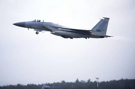 In this image provided by the U.S. Air Force, a U.S. Air Force F-15C Eagle assigned to the 493rd Fighter Squadron, Royal Air Force (RAF) Lakenheath, takes off in support of North Atlantic Treaty Organization enhanced air policing missions with the Polish Air Force at Lask Air Base, Poland, Feb. 15, 2022. Russia's attack on Ukraine's Zaporizhzhia nuclear power plant has renewed calls for NATO to impose a no-fly zone over Ukraine, despite the repeated rejection of the idea by western leaders conce