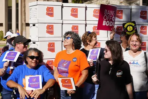 Arizona abortion-rights supporters gather for a news conference prior to delivering more than 800,000 petition signatures to the state Capitol to get abortion rights on the November general election ballot, July 3, 2024, in Phoenix. (AP Photo/Ross D. Franklin, File)